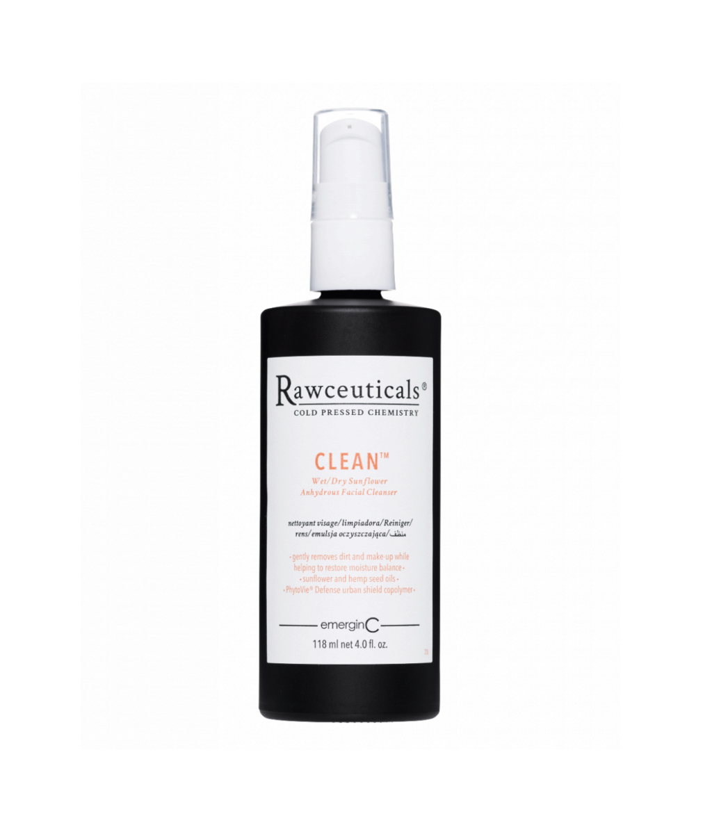 Elegant black bottle of CLEAN™ facial cleanser with a white dispenser pump.