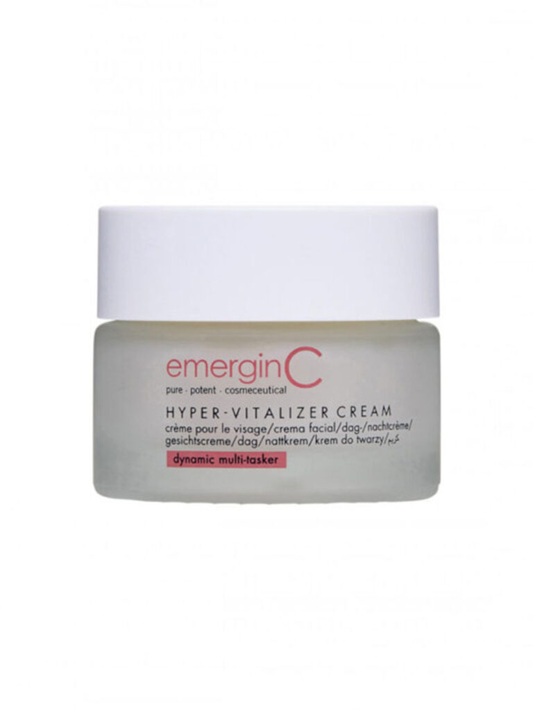 A frosted glass jar of hyper-vitalizer cream with a white lid features the brand name in red, product details in black, and a pink highlight stating "dynamic multi-tasker.