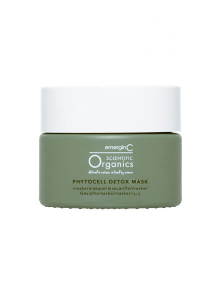 A green jar of phytocell detox mask with a white lid is displayed against a plain white background. The label features the product name in white and green text.