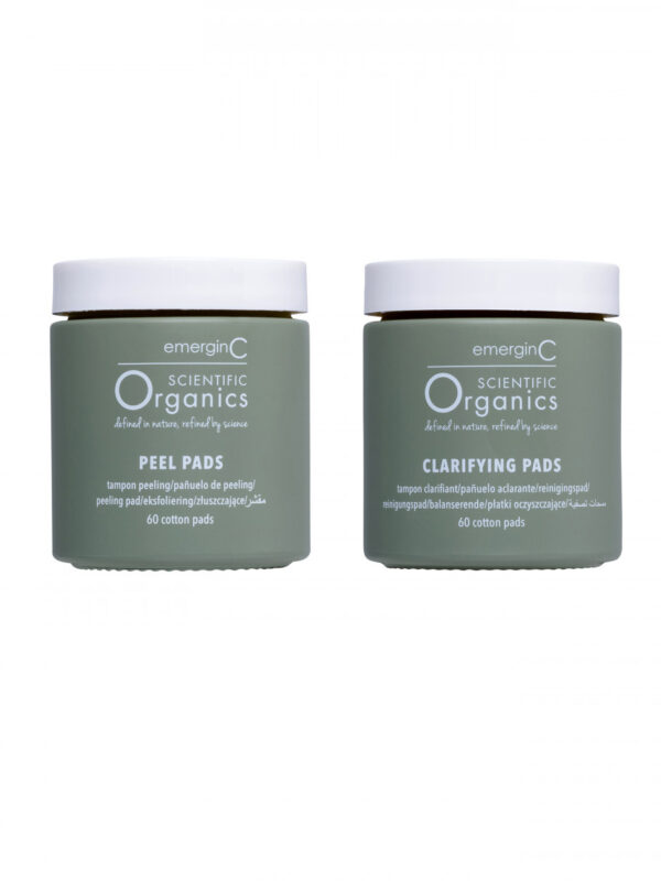Two jars of at-home facial peel + clarifying kit skincare products, one labeled "peel pads" and the other "clarifying pads," each containing 60 cotton pads.