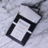 A RAW CLOTH™ pouch placed on a marble surface.