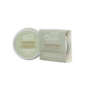 A jar of emerginc scientific organics in lips we trust super antioxidant lip balm next to its packaging box, highlighted for its protective and soothing properties with plant-based butters.