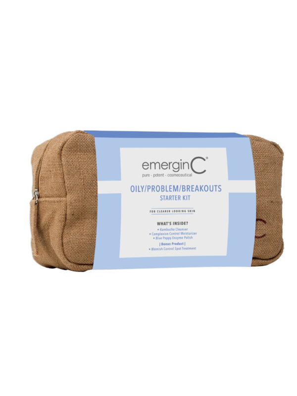 A small toiletry bag branded with the name "emerginc" which contains a Oily/Problem/Breakouts Starter Kit.