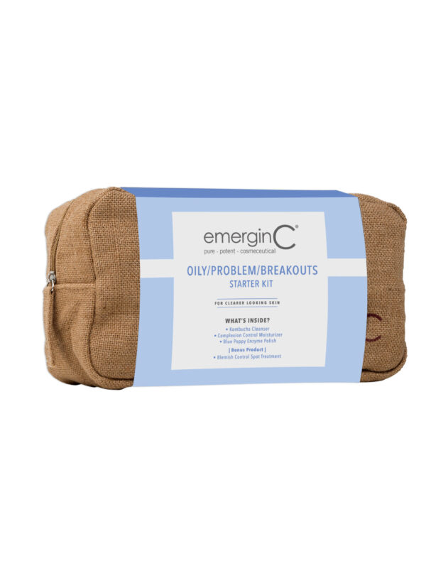 A small toiletry bag branded with the name "emerginc" which contains a Oily/Problem/Breakouts Starter Kit.