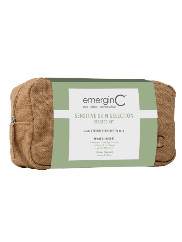 A beige travel-sized toiletry bag with the "emerginc" brand logo, advertising a Sensitive Skin Collection Starter Kit, featuring clean skincare products, wheat and gluten-free, with no synthetic fragrances or colors.