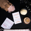 At-Home Luxury Spa Kit - Signature for a relaxing self-care routine, featuring bath salts, skincare products, a candle, and fresh eucalyptus on a dark background.
