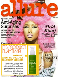 Allure magazine cover featuring Nicki Minaj with pink curly hair. Headlines mention anti-aging tips, good-mood hair, and spotlight the award-winning skin care product, EmerginC Scientific Organics Kombucha Cleanser.